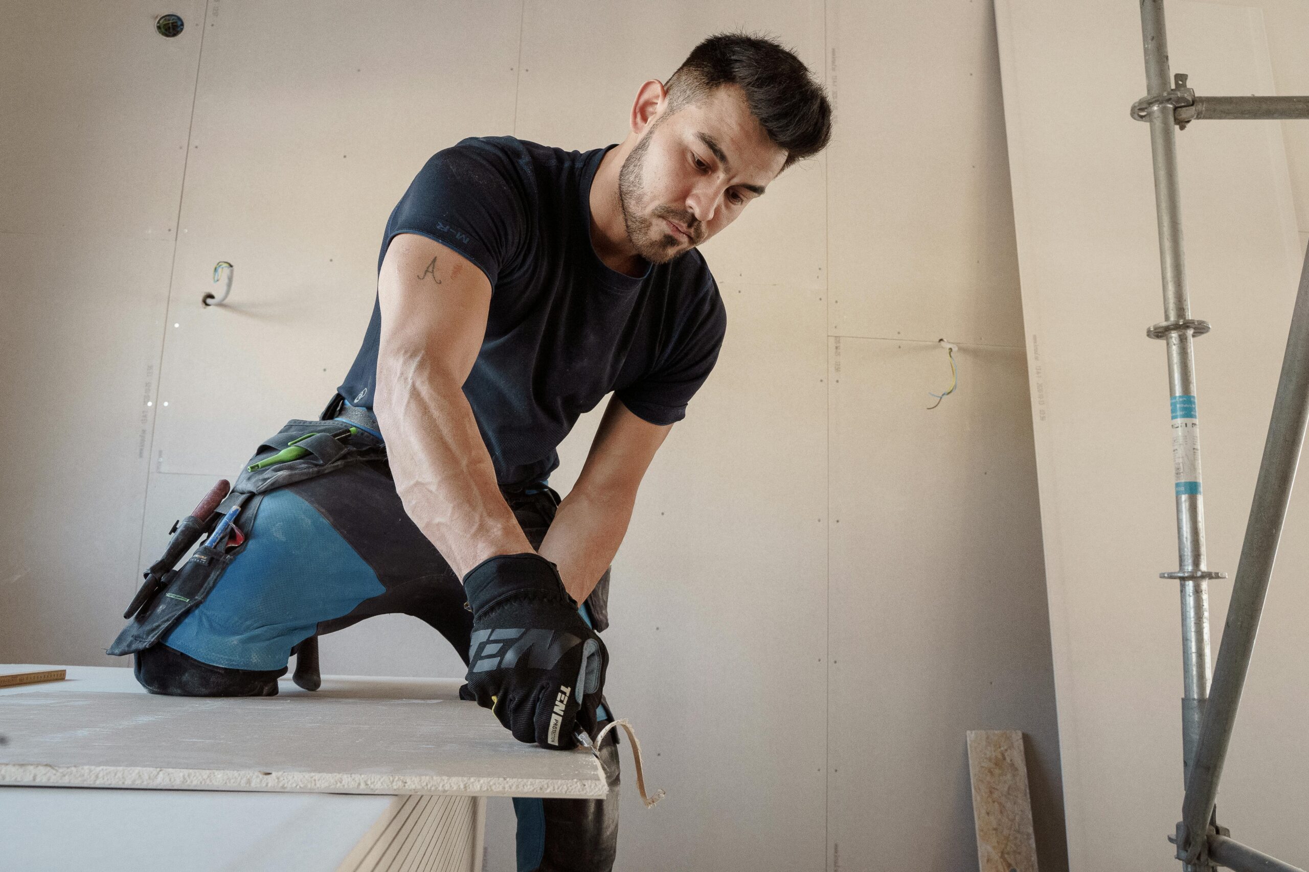 Man Cutting a Plasterboard